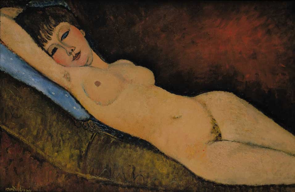 Naakt liggend op blauw kussen door Amedeo Modigliani