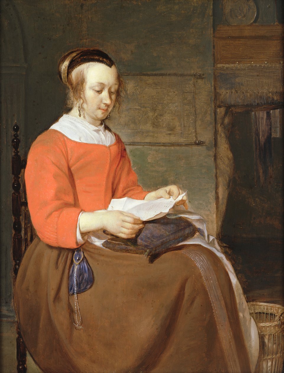 Een jonge vrouw zittend in een interieur, een brief lezend door Gabriel Metsu