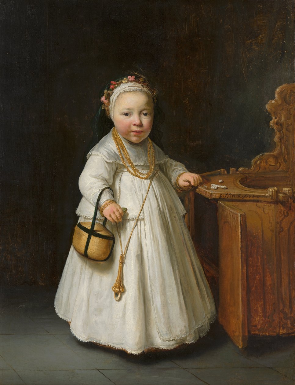 Meisje bij een kinderstoel door Govert Flinck