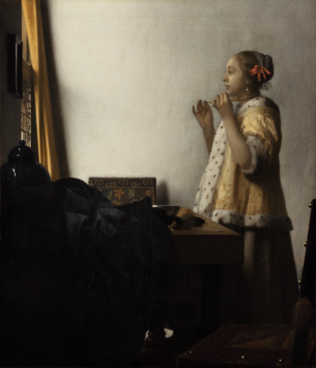 Jonge vrouw met parelketting door Johannes Vermeer