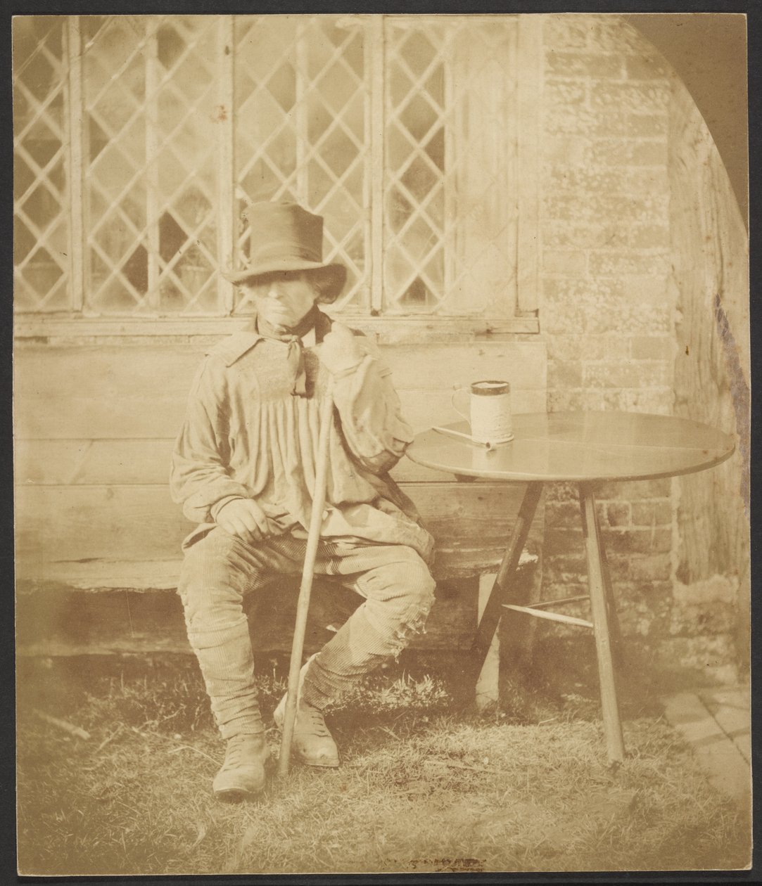 [Man zittend aan tafel] door John Whistler