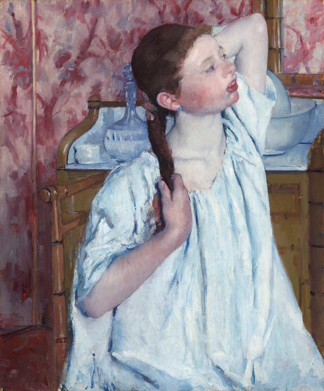 Meisje dat haar haar arrangeert door Mary Cassatt