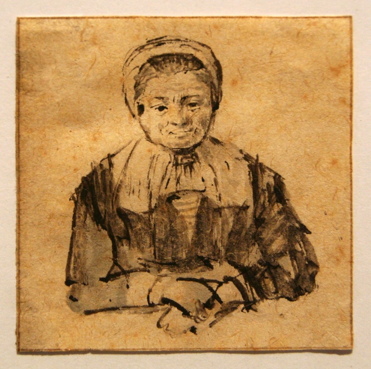 Oude vrouw met gevouwen handen door Rembrandt van Rijn