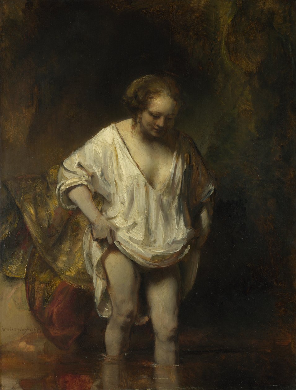 Vrouw badend in een stroom door Rembrandt van Rijn
