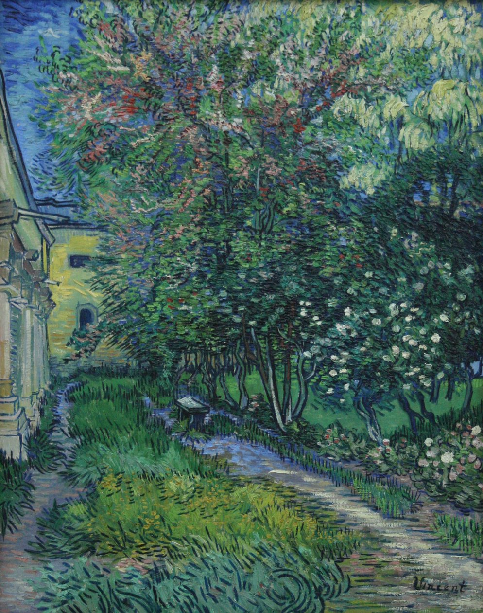 De tuin van de inrichting in Saint-Rémy door Vincent van Gogh