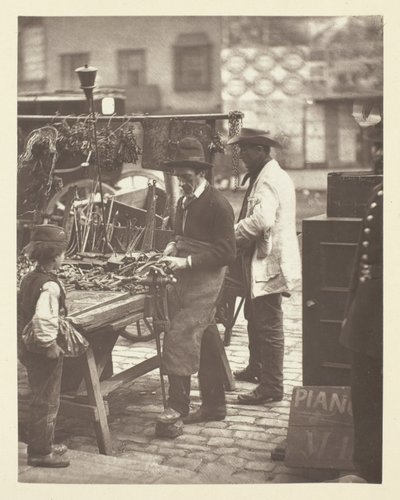 De Straatslotenmaker door John Thomson